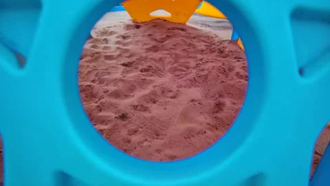 48686 Colorful Playground Structure Frames Sandy Area Inviting Children to .. Stock Footage 304169802