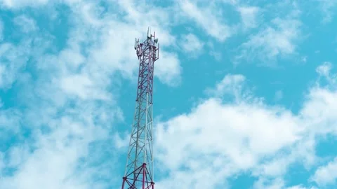 A 4G and 5G cell tower against the cloudy sky 4k time lapse footage. Video stock 158174415