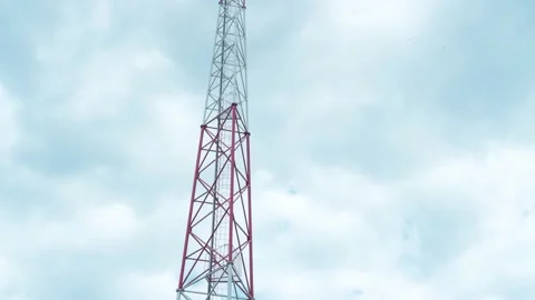 A 4G and 5G cell tower against the cloudy sky 4k time lapse footage. Stock Footage 158174465