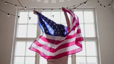 4k 10 bit. American winner. US flag. National celebration. Silhouette of a woman Stock Footage 153042347