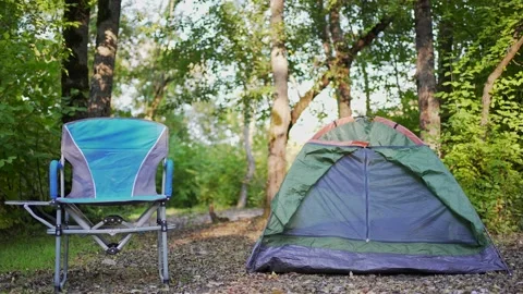 4K 10 bit. Camping. Tent and chair for rest in the forest. Recreation and Stock Footage 162235995