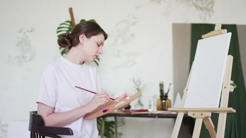 4K 10 bit. Creative hobby. Portrait of a female artist in an art studio Stock Footage 156210440