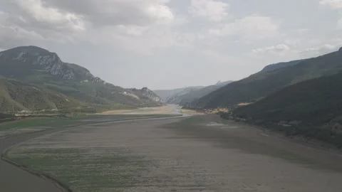 4K 10-bit drone shot flying forward low over a green river inside the giant Stock Footage 337647739