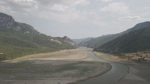 4K 10-bit drone shot flying forward low over a green river inside the giant Stock Footage 337647832