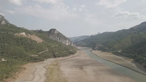 4K 10-bit drone shot flying forward low over a green river inside the giant Stock Footage 337648337