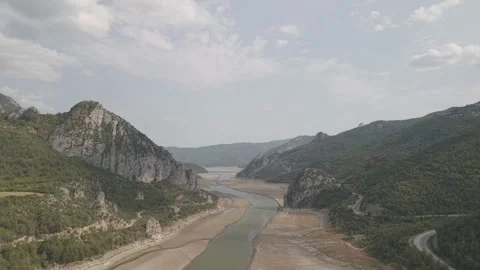 4K 10-bit drone shot flying forward low over a green river inside the giant Stock Footage 337649355