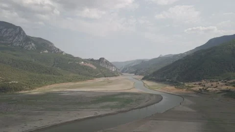 4K 10-bit drone shot flying forward low over a green river inside the giant Stock Footage 337649430