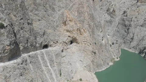 4K 10-bit drone shot flying forward low over the hand-carved stone road heading 스톡 동영상 342267601