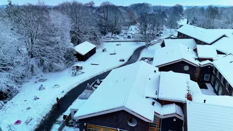 4K 10Bit Aerial View of Snow Covered Housing Estate in Winter Forest Stock Footage 334837616