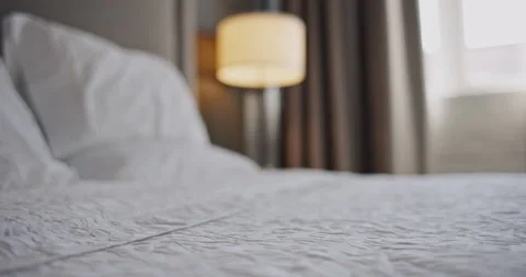 4K 120 fps (23.98) Shallow Depth of Field dolly back over freshly made hotel bed Stock Footage 219357932