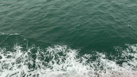 4K 120fps High Frame Rate Emerald Ocean Water and Sea Foam Top-Down Stock Footage 330916756