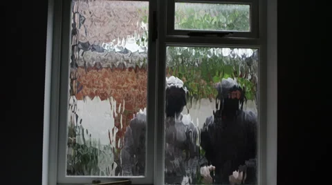 4K 2 masked burglars breaking and entering into a victim's home Stock Footage 46624481
