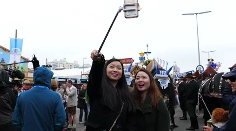 4K 2016 Asian tourists take Selfie Munich Oktoberfest Octoberfest German Beer Stock Footage