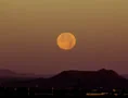 4K 24p wide supermoon set over desert mountains in the morning 4k or 4k+ Resolution