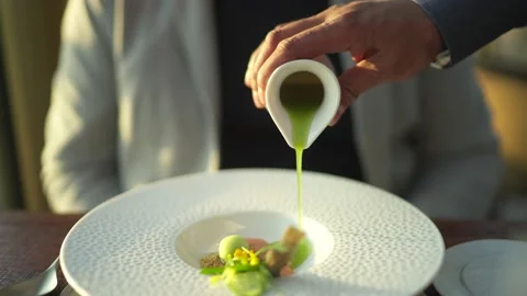 4K 25 fps chef pouring gravy to a plate at a restaurant slowmotion Stock Footage 171209898