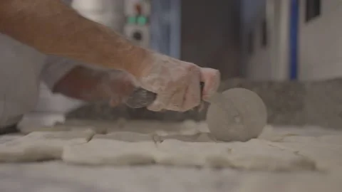 4K 25 fps slowmotion baker slicing bread faster Stock Footage 171130402