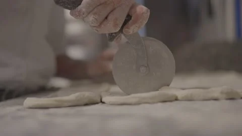 4K 25 fps slowmotion baker slicing bread slow Stock Footage 171130407