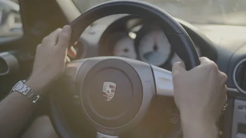 4K 25 fps slowmotion close up man driving Porsche sunset Stock Footage 171130410