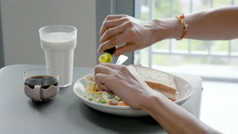 4K 25fps Slow Motion, A close-up of the hand is pouring fish sauce over Stock Footage 172559986