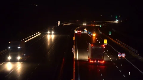 4k 25p Abstract black night illuminated highway on dark background. Two-lanes Stock Footage 115940130