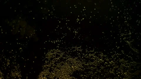 4K 29,97 fps Cinematic Macro Golden Yellow Bubbles Floating on Liquid Surface Stock Footage 324702547