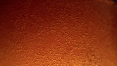 4K 29.97fps Macro Shot: Beer Pouring Action with Bubbles and Condensation Stock Footage 321689550