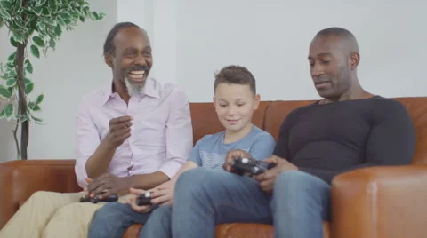4K 3 Male generations of happy family playing video games together at home Stock Footage