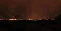 4K 30p - Night time curtain of rain over a city in time lapse 4k or 4k+ Resolution
