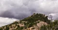 4K 30p  People on stacked rocks storm clouds time lapse slider shot 4k or 4k+ Resolution