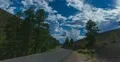 4K 30p tight The lava sand mounds of Sunset Crater Arizona with monsoon clouds 4k or 4k+ Resolution