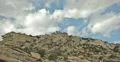 4K 30p v2 Mountain cliff side with clouds passing in time lapse 4k or 4k+ Resolution