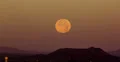 4K 30p wide supermoon set over desert mountains in the morning 4k or 4k+ Resolution