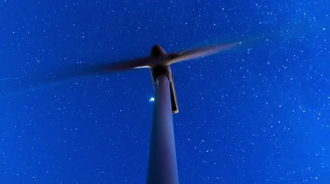 4K 30p wind mill turbines site on mountain timelapse with stars galaxy sky Stock Footage 56691904
