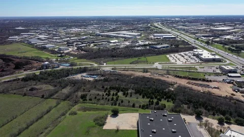 4K 360 Orbit motion view SH 45 and IH-35 busy shopping plaza Round Rock, TX Stock Footage 124107748