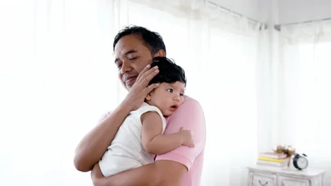 4K 50fps, Asian single dad, holding his adorable son in his arms, Stock Footage 171565705