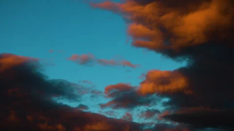 4K 50fps Time-Lapse: High-Contrast Orange and Teal Sunset Cloudscape Stock Footage 318592187