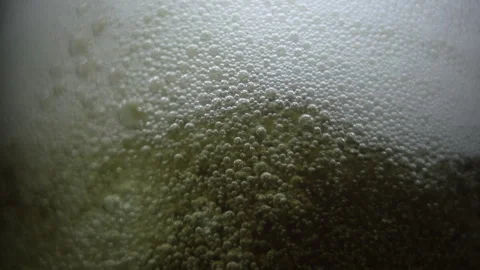 4K 59,94 fps  Effervescence Texture Drink Pouring and Mixing with Dense Foam Stock Footage 324694630