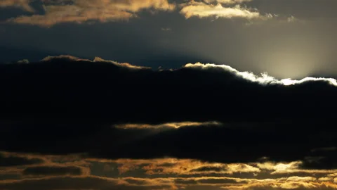 4K 59,94 fps  Sunset Sky: Dynamic Clouds with Sun Flare Moving Right to Left Stock Footage 325185887