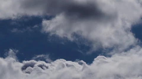 4K 59.94fps Sky Timelapse Dramatic Cumulus Clouds Billowing on Blue Sky (UHD) Stock Footage 324694554