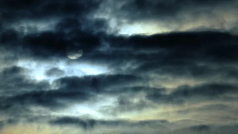 4K 59.94fps Timelapse: Pale Sun Peeking Through Heavy Cloud Layers 스톡 동영상 329673216