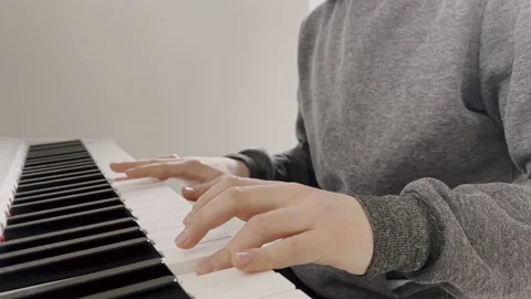 4K 60fps of childs hands playing piano Stock Footage 170090437