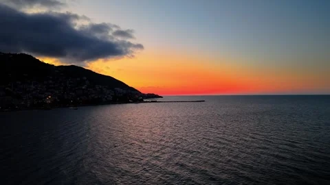 4K 60FPS Cinematic Red Sunset Over Clouds and Island | Drone Shot Video stock 334308751