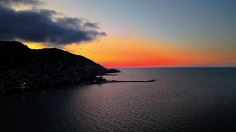 4K 60FPS Cinematic Red Sunset Over Mountains and Sea | Drone Shot Stock Footage 334309652