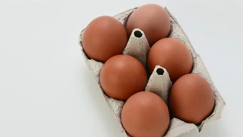 4k 60fps close up video of chicken brown eggs in tray Stock Footage 168993904