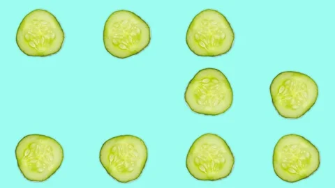 4K 60FPS Cucumber Slice on the Blue Background - Pop Up Animation Stock Footage 142109335