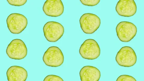 4K 60FPS Cucumber Slice on the Blue Background is Moving Vertical and Rotating Stock Footage 142109350