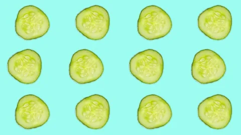 4K 60FPS Cucumber Slice on the Blue Background Stock Footage 142109355