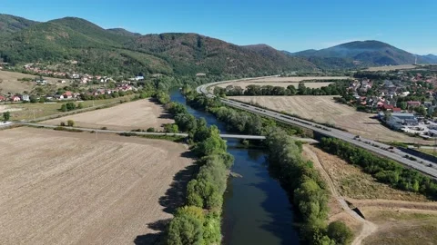 4K 60fps Drone Flyover: Hron River Valley and Footbridge Stockbeeldmateriaal 344135915