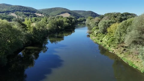 4K 60fps Drone Flyover: Scenic Hron River and Forest Hills Stockbeeldmateriaal 344138147