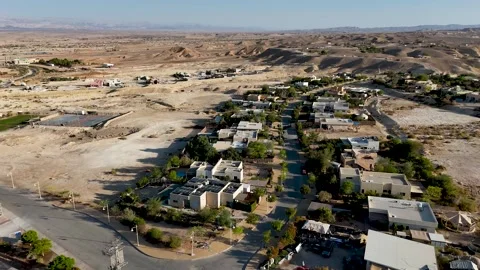 4K 60fps drone footage hovering above Zukim, Israel, rotating clockwise to Stock Footage 344094841
